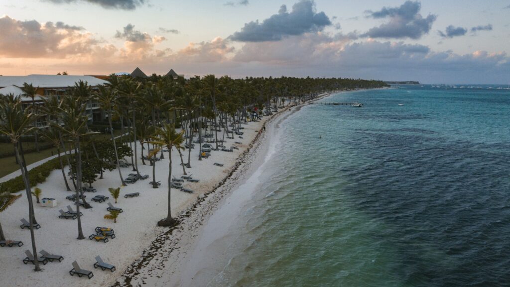 Landscape of the Punta Cana Beach surrounded by the sea and greenery in the Dominican Republic